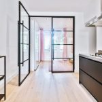 Opened,Glass,Door,Leading,Into,Bedroom,From,Stylish,Kitchen,In