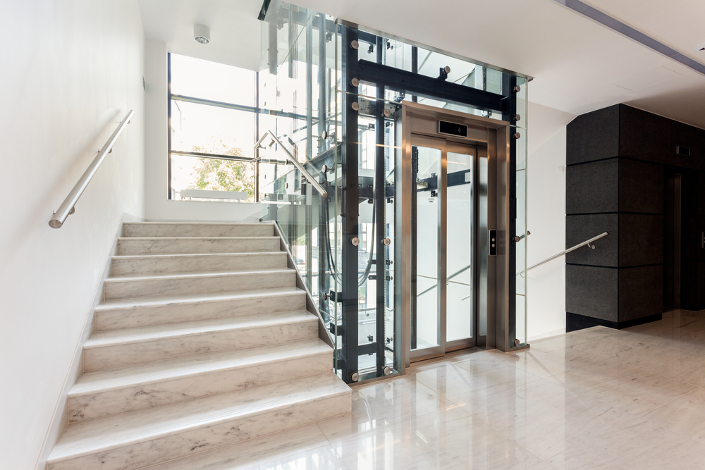 Hall,With,Staircase,And,Elevator,Inside,The,Building